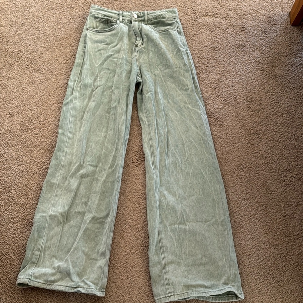 Green flared jeans